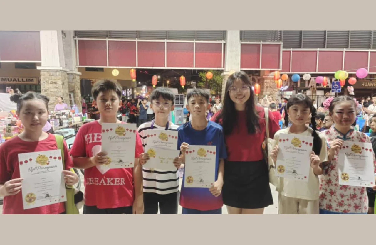 Students gathered with certificates after an art event