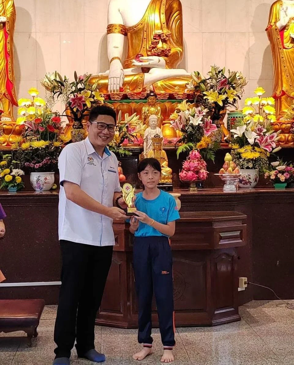 Young student receiving recognition during an award ceremony