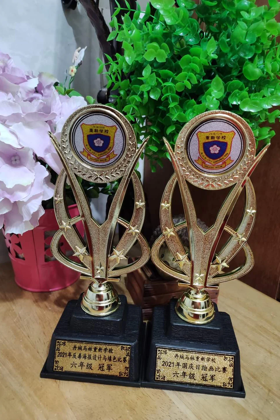 A pair of achievement trophies displayed outdoors