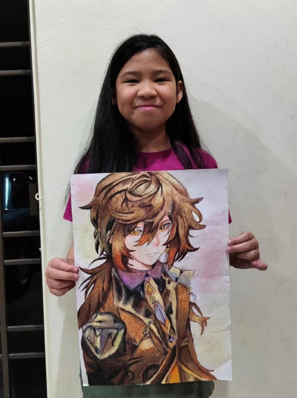 Student holding a detailed fantasy warrior illustration