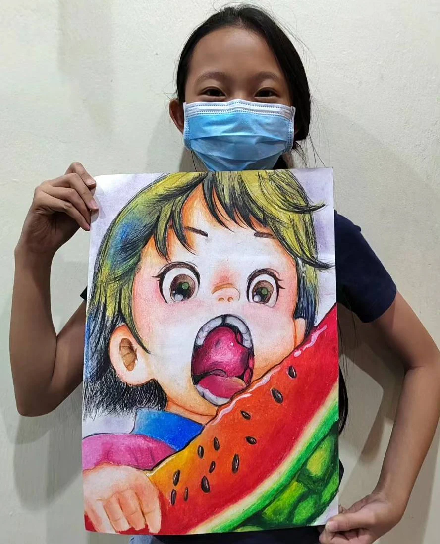 Student holding an expressive character eating watermelon